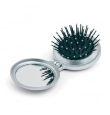 Brosse pliable avec miroir dans un boîtier en plastique